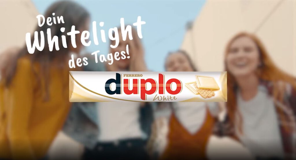 duplo white logo with happy people in the background